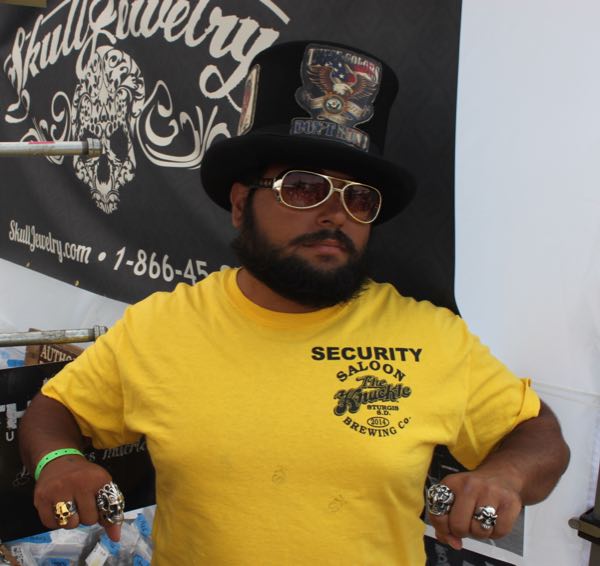 The Knuckle security guard wearing skull rings